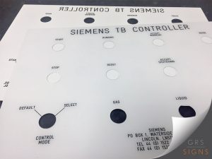 A custom Siemens TB Controller front panel, manufactured from acrylic with precision-cut circular holes for switches, indicator lights, and control buttons. Black printed text identifies various functions including Start, Stop, Reset, Running, Accept Warning, Accept Shutdown, Control Mode, Gas, and Liquid. Technical contact information for Siemens Waterside is printed in the lower corner.