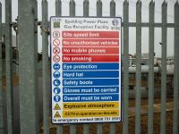 Fence-mounted warning, mandatory and prohibitions safety sign at Spalding Energy/InterGen