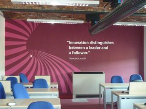 Bold wall art with pattern and quote in varying plum shades with white text.