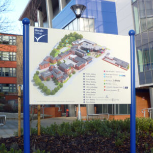External dual-post mounted campus map at Lincoln College with building diagrams and a key.