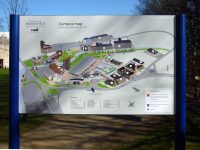 Dual post mounted wayfinding map, installed externally at University of Huddersfield, including a key and notices.