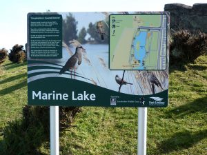 Dual-post mounted aluminium sign, installed externally, featuring a map, key and information at Marine Lake in Lincolnshire.